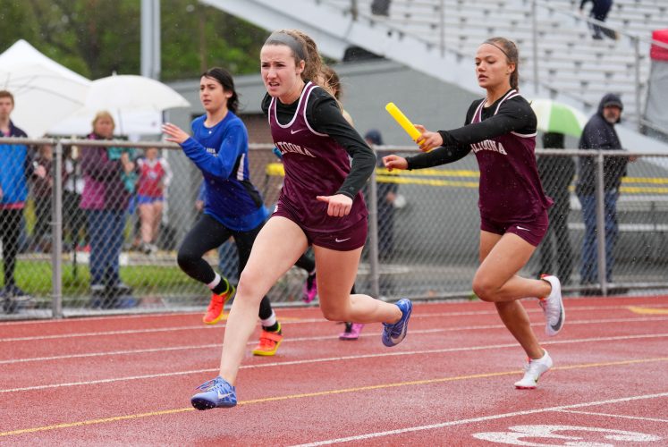 AAHS boys, girls make the best of rainy conditions